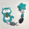 teal raccoon teething clip