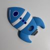 blue rocketship teething pendant