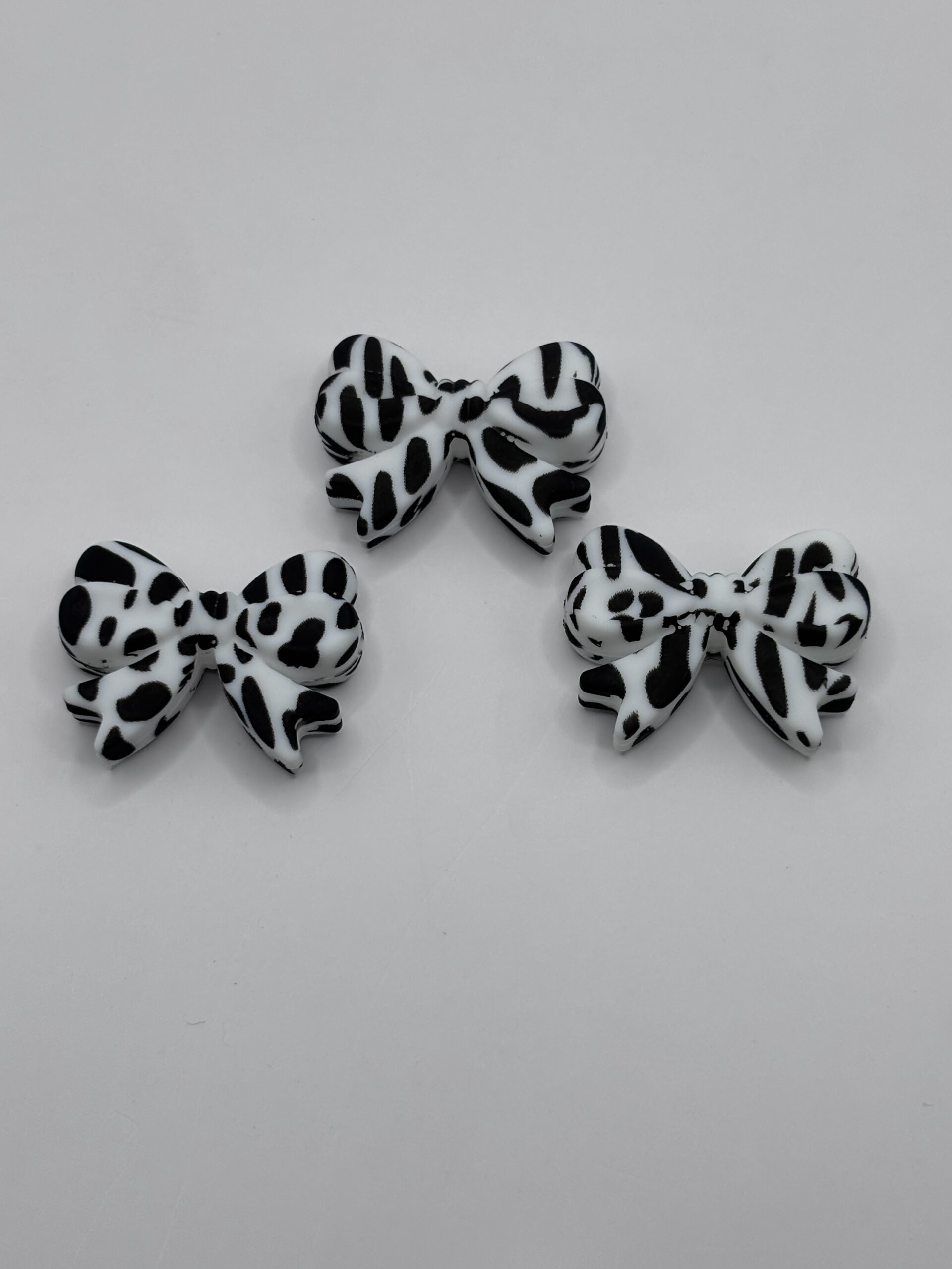 Silicone White Cow Print Bow Beads